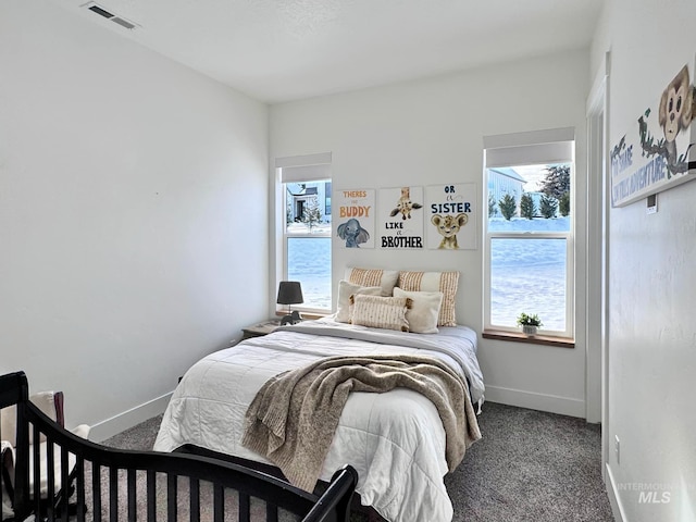 carpeted bedroom with baseboards