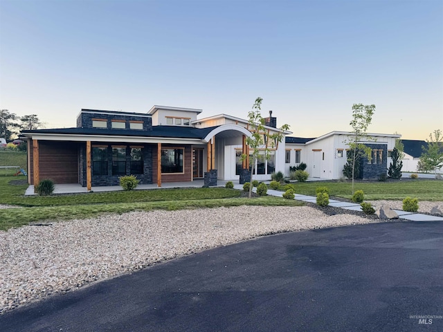 view of front of property with a front yard and a porch