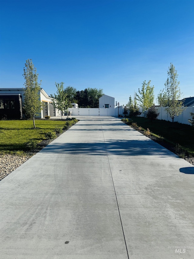 view of concrete surface with a gate