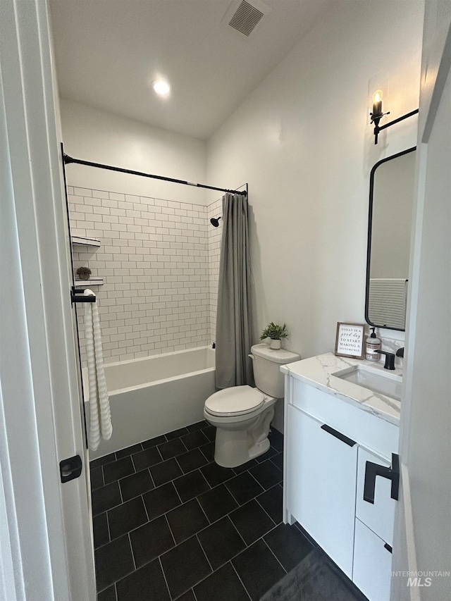 15006 Snow Mountain Dr, Caldwell, ID 83607 - bathroom featuring vanity, toilet, tile patterned flooring, and shower / tub combo with curtain