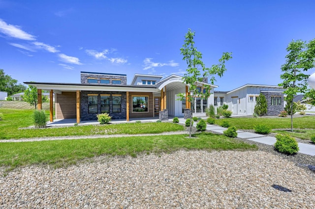 15006 Snow Mountain Dr, Caldwell, ID 83607 - view of front of house with a front yard and stone siding