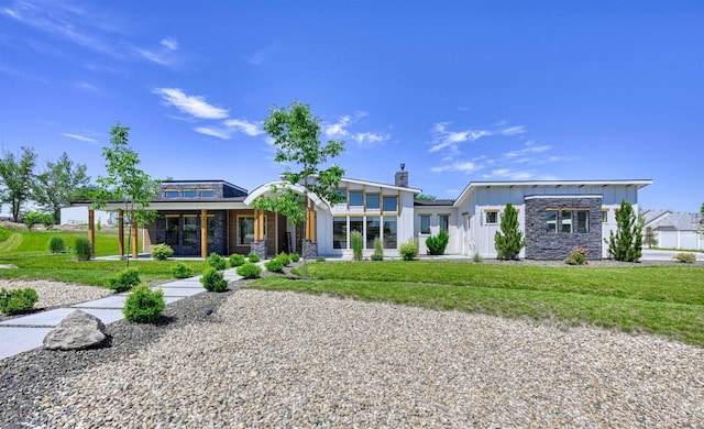 15006 Snow Mountain Dr, Caldwell, ID 83607 - view of front of property featuring a porch, stone siding, a front yard, and a chimney