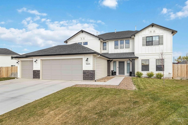 traditional-style house with a garage, board and batten siding, fence, and driveway