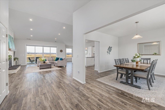 9805 Salmon Ridge Pl, Nampa, ID 83686 - dining room with baseboards, wood finished floors, recessed lighting, and high vaulted ceiling