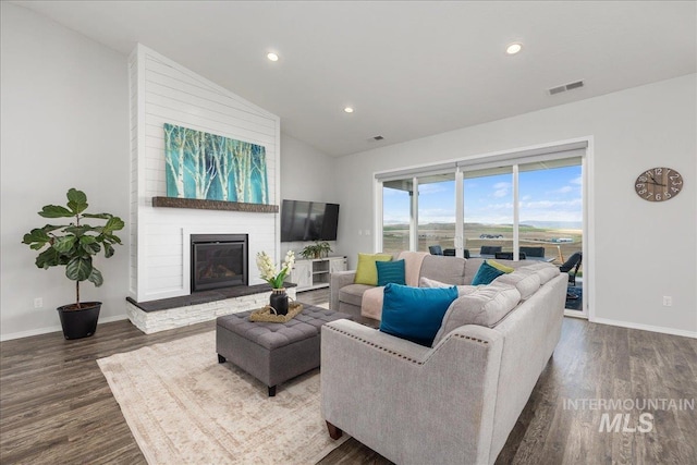 9805 Salmon Ridge Pl, Nampa, ID 83686 - living room featuring wood finished floors, baseboards, recessed lighting, a fireplace, and high vaulted ceiling