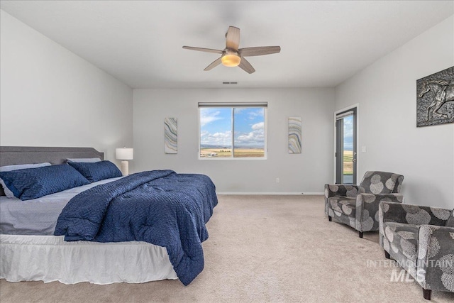 9805 Salmon Ridge Pl, Nampa, ID 83686 - bedroom featuring light colored carpet, multiple windows, ceiling fan, and baseboards