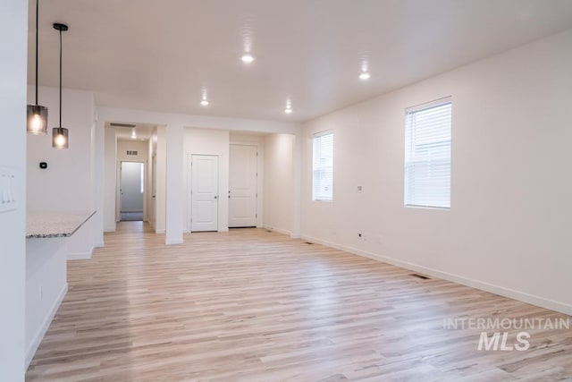 unfurnished room featuring light wood-type flooring