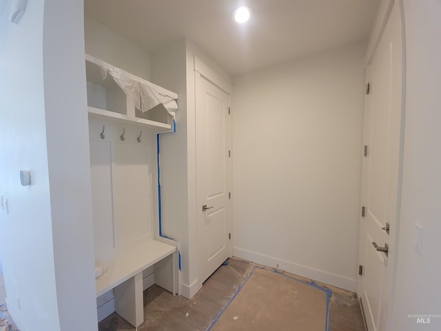 mudroom featuring recessed lighting and baseboards