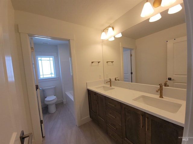 2051 E Brace St, Meridian, ID 83642 - bathroom with toilet, double vanity, a tub, a shower, and baseboards