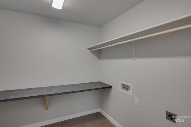 laundry area with laundry area, dark wood-style flooring, hookup for a washing machine, and baseboards