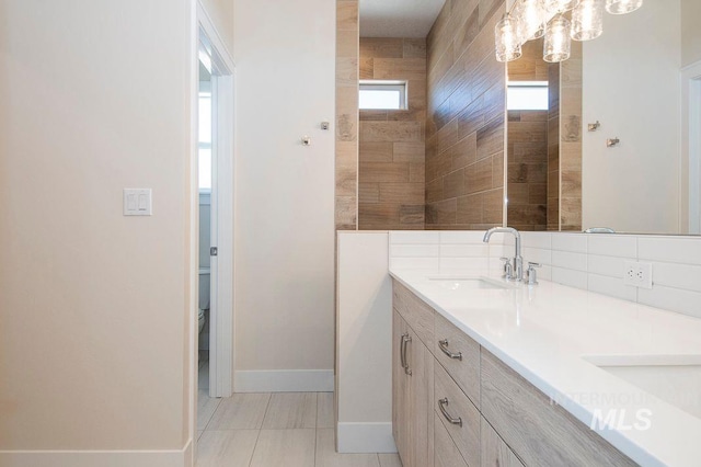 bathroom with tile patterned flooring and vanity