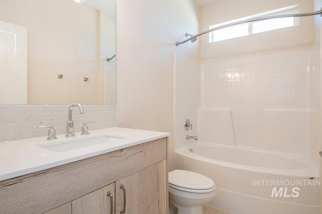 full bathroom with vanity, tasteful backsplash, toilet, and tub / shower combination