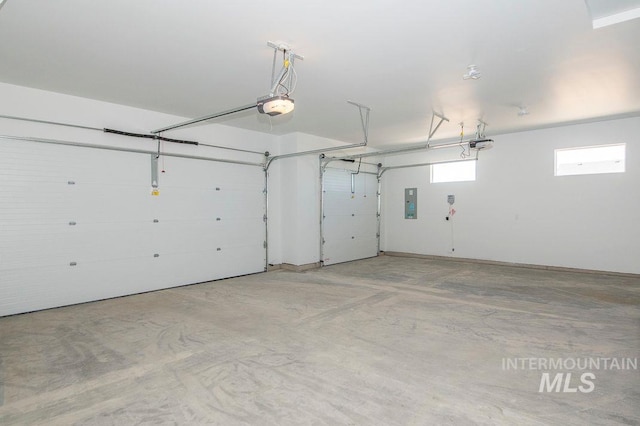 garage featuring electric panel and a garage door opener