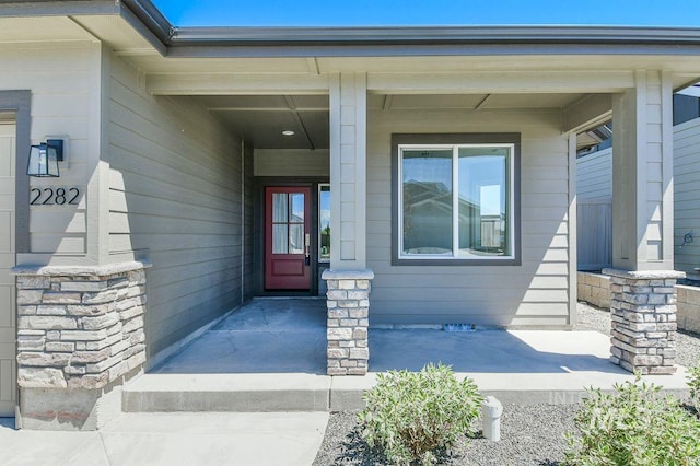 entrance to property featuring a porch