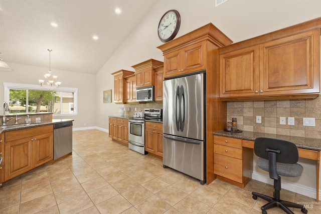 2790 S Mcdermott Rd, Nampa, ID 83687 - kitchen featuring appliances with stainless steel finishes, a sink, brown cabinets, decorative backsplash, and light tile patterned floors