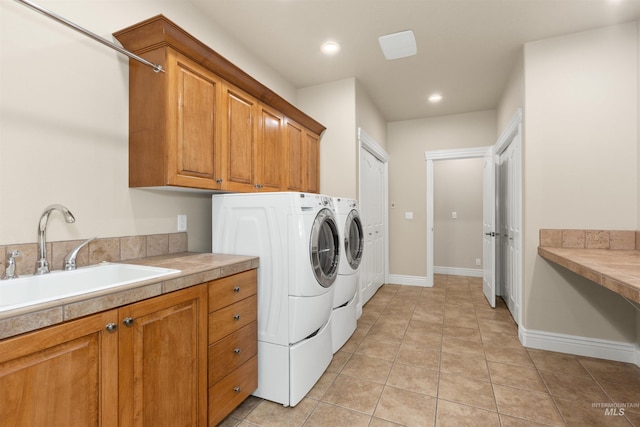 2790 S Mcdermott Rd, Nampa, ID 83687 - laundry area with separate washer and dryer, cabinet space, recessed lighting, baseboards, and light tile patterned floors