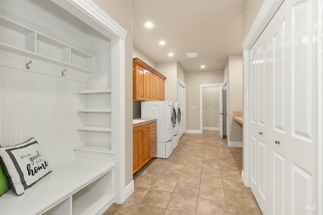 2790 S Mcdermott Rd, Nampa, ID 83687 - laundry room with washing machine and dryer, cabinet space, recessed lighting, light tile patterned floors, and baseboards