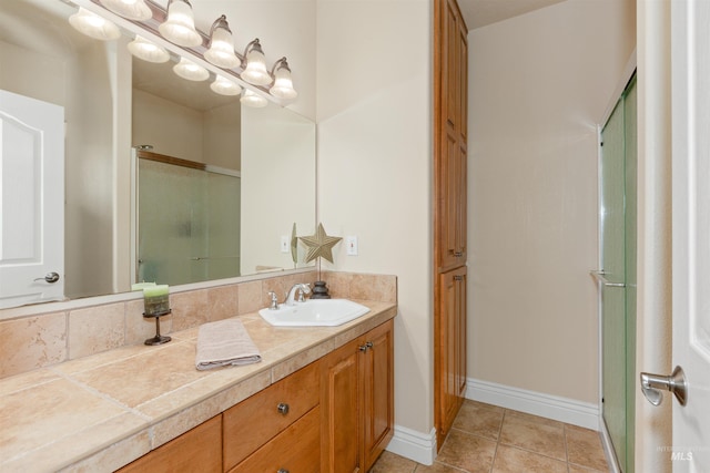 2790 S Mcdermott Rd, Nampa, ID 83687 - bathroom with a shower stall, vanity, baseboards, and tile patterned flooring