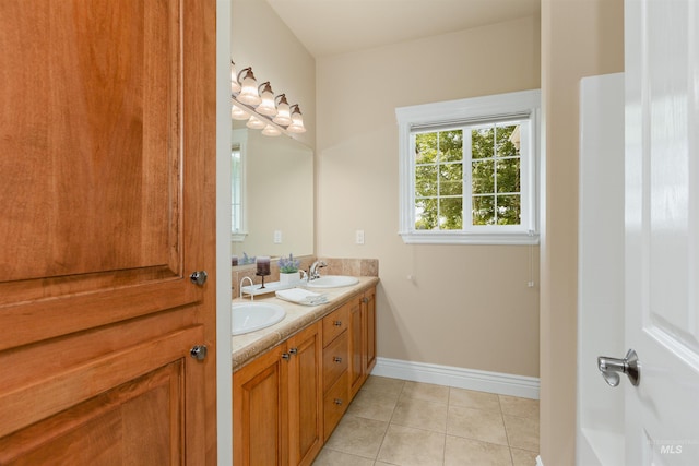 2790 S Mcdermott Rd, Nampa, ID 83687 - full bathroom featuring double vanity, tile patterned flooring, and baseboards