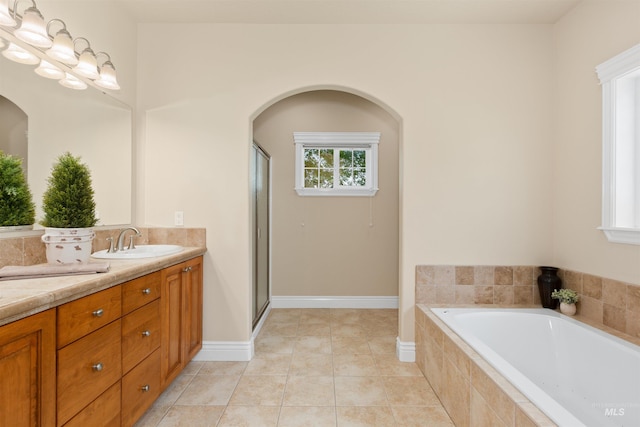 2790 S Mcdermott Rd, Nampa, ID 83687 - bathroom with vanity, a bath, a shower stall, and tile patterned flooring
