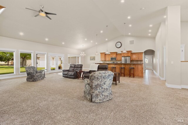2790 S Mcdermott Rd, Nampa, ID 83687 - living room with a ceiling fan, light colored carpet, arched walkways, high vaulted ceiling, and recessed lighting