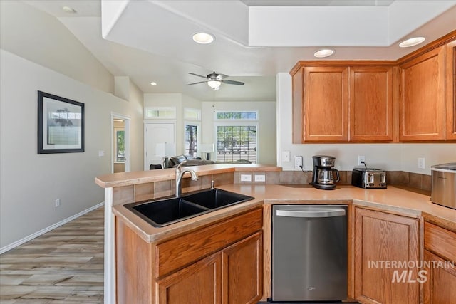 3918 Fallwood Cir, Caldwell, ID 83607 - kitchen with a sink, dishwasher, a peninsula, open floor plan, and a ceiling fan