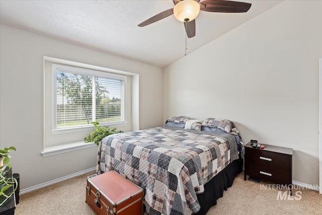 3918 Fallwood Cir, Caldwell, ID 83607 - bedroom featuring light colored carpet, baseboards, vaulted ceiling, and ceiling fan