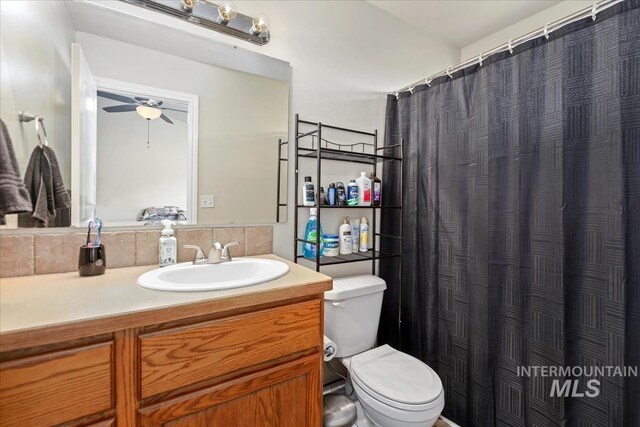 3918 Fallwood Cir, Caldwell, ID 83607 - bathroom with toilet, vanity, ceiling fan, and a shower with curtain
