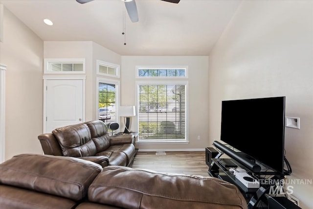 3918 Fallwood Cir, Caldwell, ID 83607 - living area with wood finished floors, a ceiling fan, and baseboards