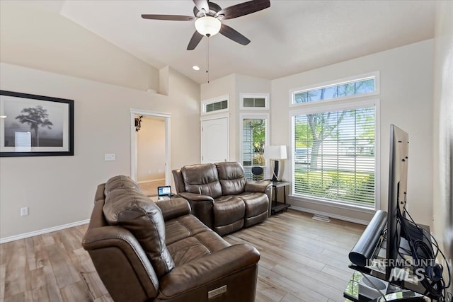 3918 Fallwood Cir, Caldwell, ID 83607 - living area with a ceiling fan, plenty of natural light, light wood-type flooring, baseboards, and lofted ceiling