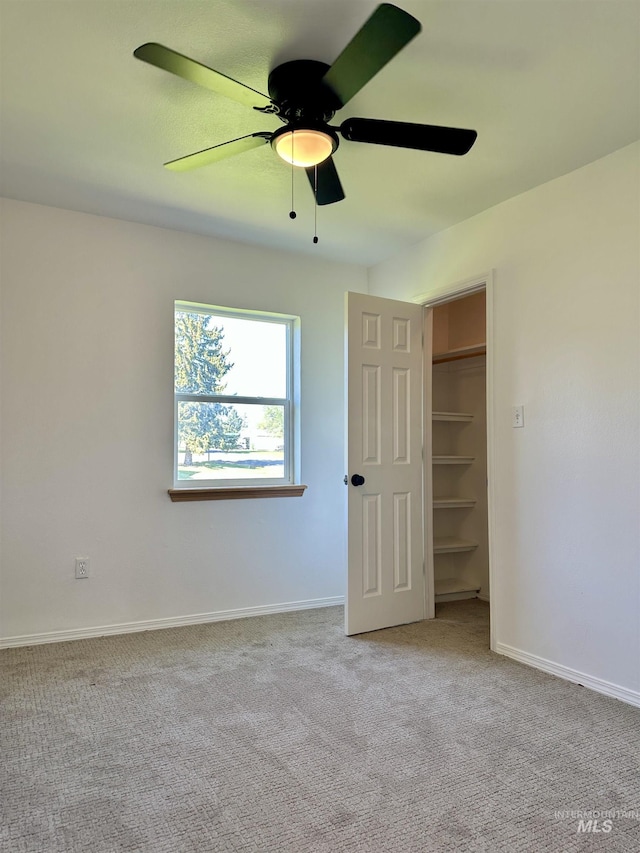 408 Walnut St, Nezperce, ID 83543 - unfurnished bedroom with carpet floors, baseboards, and a ceiling fan