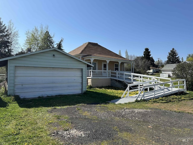 408 Walnut St, Nezperce, ID 83543 - view of front of house with covered porch and a detached garage