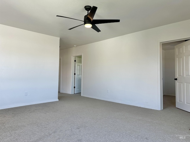 408 Walnut St, Nezperce, ID 83543 - spare room with a ceiling fan, baseboards, and light carpet