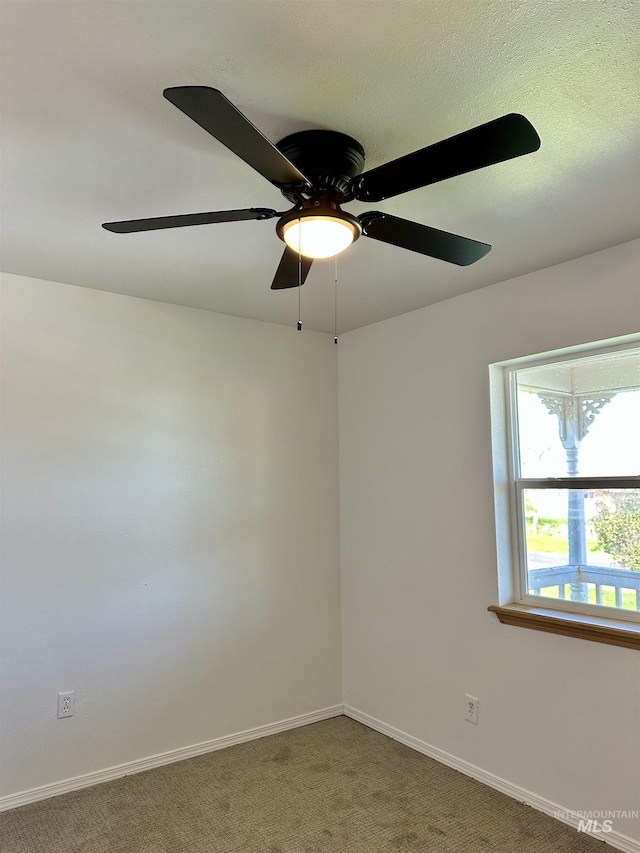 408 Walnut St, Nezperce, ID 83543 - spare room featuring baseboards, carpet flooring, and a ceiling fan