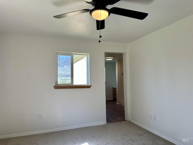 408 Walnut St, Nezperce, ID 83543 - carpeted spare room with baseboards and a ceiling fan