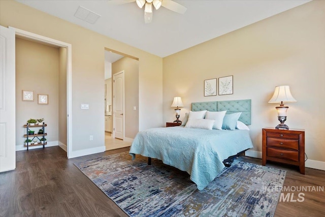 bedroom featuring visible vents, baseboards, wood finished floors, and a ceiling fan