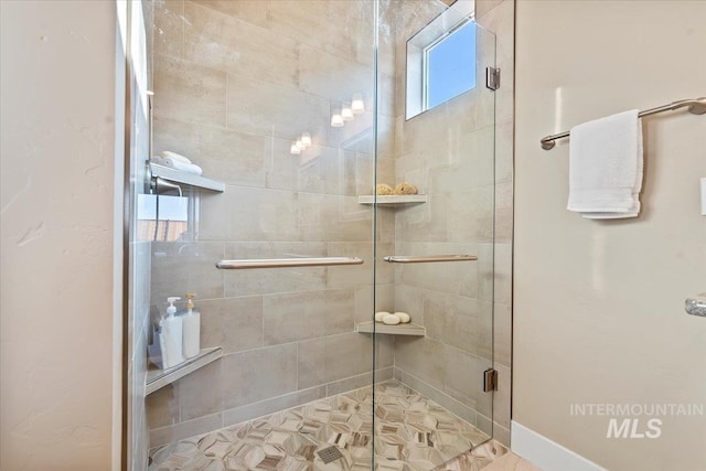 full bath with a shower stall