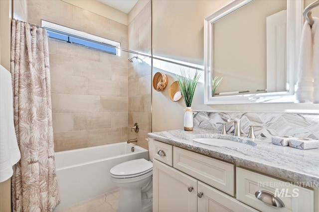 full bathroom with shower / tub combo, toilet, and vanity