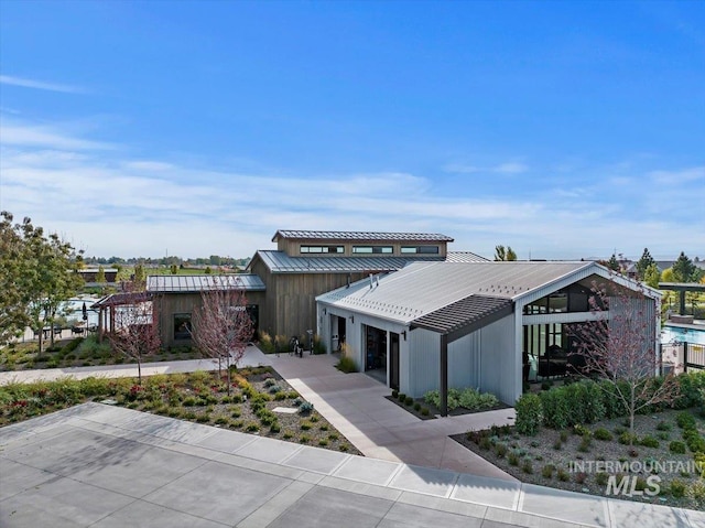 view of front of home featuring metal roof and a standing seam roof