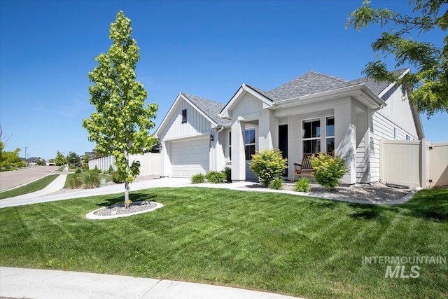 11638 W Quintale Dr, Nampa, ID 83686 - view of front of home with a garage, driveway, a shingled roof, and board and batten siding