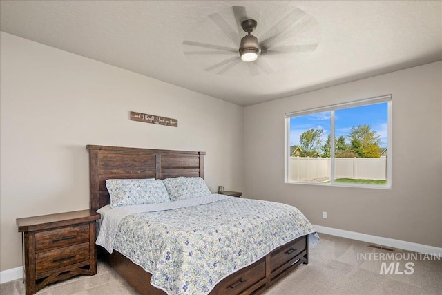 11638 W Quintale Dr, Nampa, ID 83686 - bedroom featuring baseboards, light carpet, and a ceiling fan