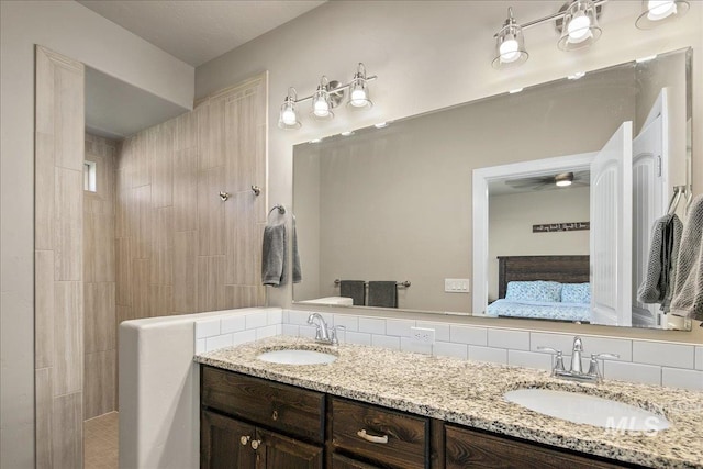 11638 W Quintale Dr, Nampa, ID 83686 - ensuite bathroom featuring double vanity, backsplash, and walk in shower