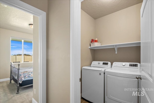 11638 W Quintale Dr, Nampa, ID 83686 - laundry area with independent washer and dryer, a textured ceiling, carpet, and baseboards