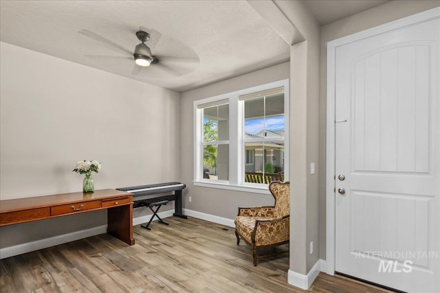 11638 W Quintale Dr, Nampa, ID 83686 - living area featuring light wood finished floors, baseboards, and a ceiling fan