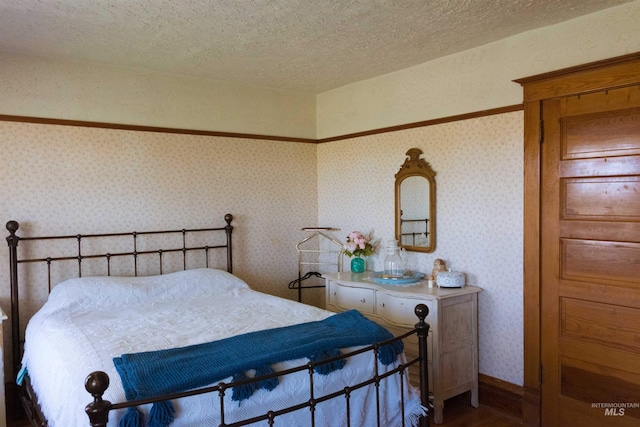 2771 S 850 E, Hagerman, ID 83332 - bedroom featuring wood finished floors, a textured ceiling, and wallpapered walls