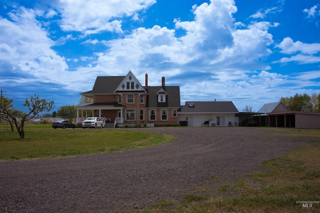 2771 S 850 E, Hagerman, ID 83332 - victorian house featuring driveway, a front yard, and a chimney