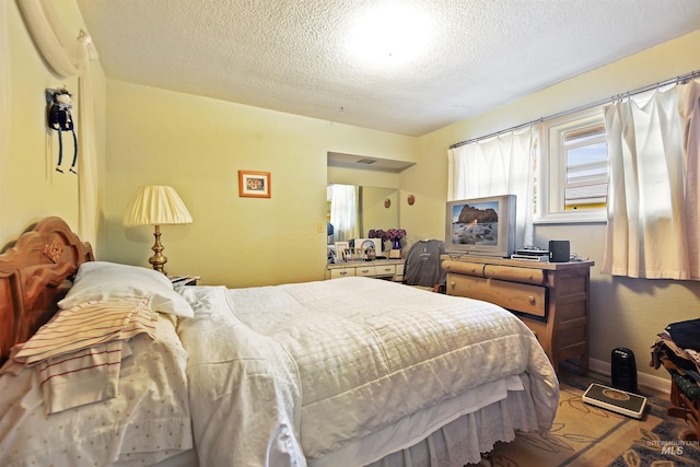 bedroom featuring a textured ceiling
