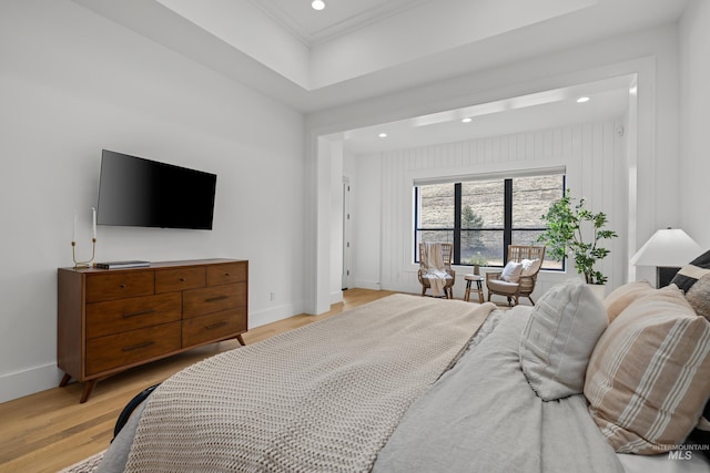 bedroom with crown molding, recessed lighting, light wood-style floors, and baseboards