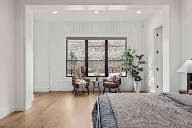 bedroom with recessed lighting, light wood-type flooring, and baseboards