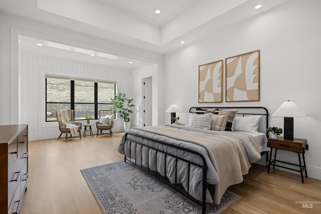 bedroom featuring recessed lighting, light wood-style floors, and crown molding